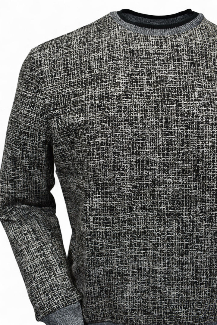 This classic crew neck sweater features a rich combination of tan, ivory, and black, making it the perfect addition to any outfit in the black or tan families. 