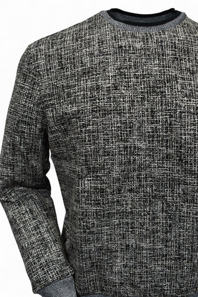 This classic crew neck sweater features a rich combination of tan, ivory, and black, making it the perfect addition to any outfit in the black or tan families. 