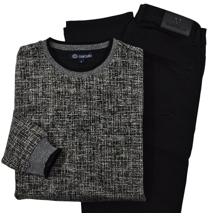 This classic crew neck sweater features a rich combination of tan, ivory, and black, making it the perfect addition to any outfit in the black or tan families. 