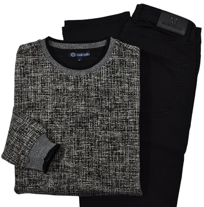 This classic crew neck sweater features a rich combination of tan, ivory, and black, making it the perfect addition to any outfit in the black or tan families. 