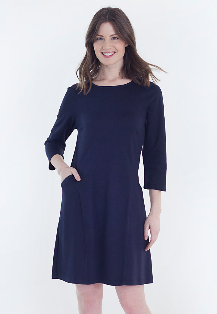 Chloe Dress, a A-Line dress, with pockets, in our tech fabric that is breathable, sustainable, and machine-washable  - Buki