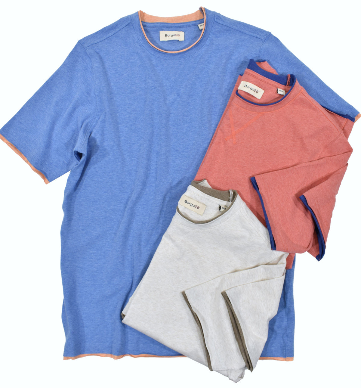 Ultra soft washed cotton with a touch of spandex for stretch comfort.  All the edges are finished with contrast color fabric to create a raw looking edge and trendy hip look.  Tonal sweatshirt enhanced stitching at the front neckline.  Classic fit.   Colors: Blue, Red, Wheat