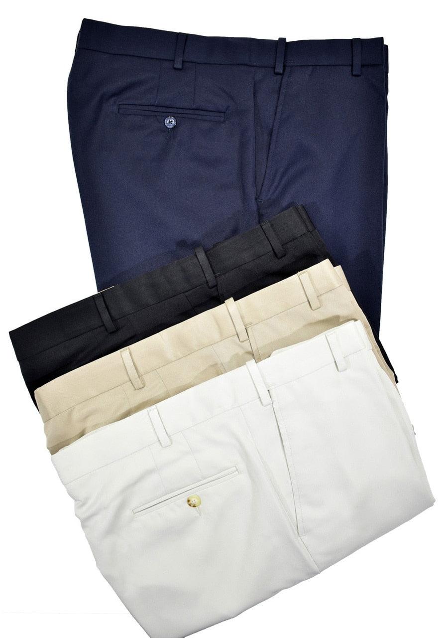 Stretch waist band microfiber walk short treated for water and stain resistance. Flat front, slash pockets and button through back pockets with a 9" inseam. Navy, Black, Tan, Ivory  Stretch waist band 2 front slash pockets 2 back welt pockets with button closures Mid rise Stain resistant