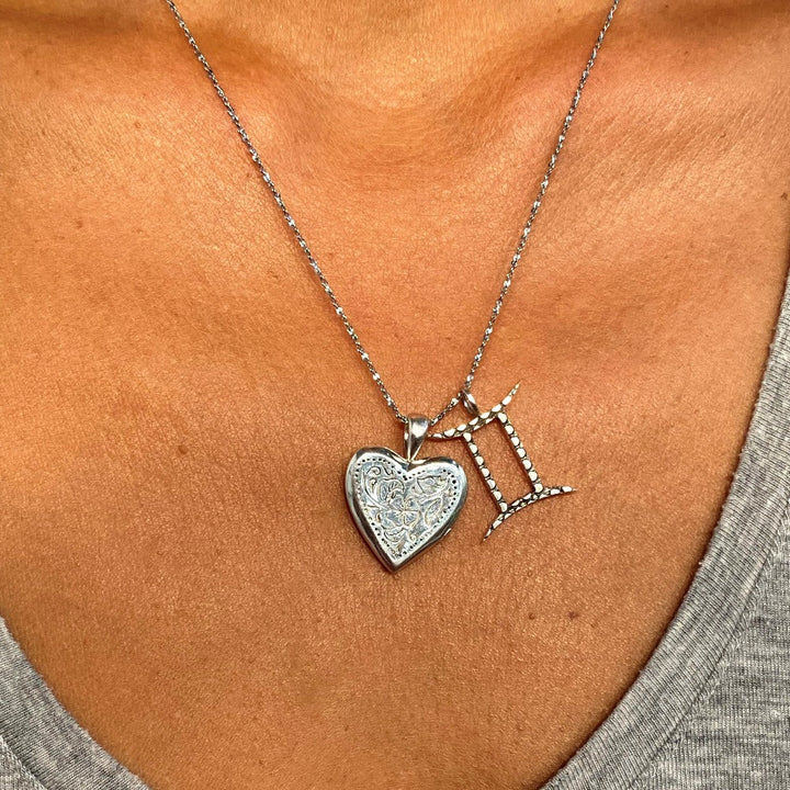 Gemini Zodiac Charm from Love Is Project with heart locket on chain
