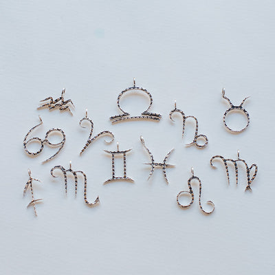 The sterling silver Zodiac Charm from Love Is Project
